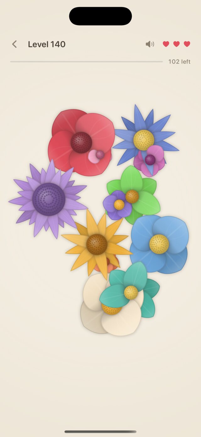 Level 140: a dense bouquet of a dozen flowers in red, blue, violet, green, amber and cream, their petals lying over one another.