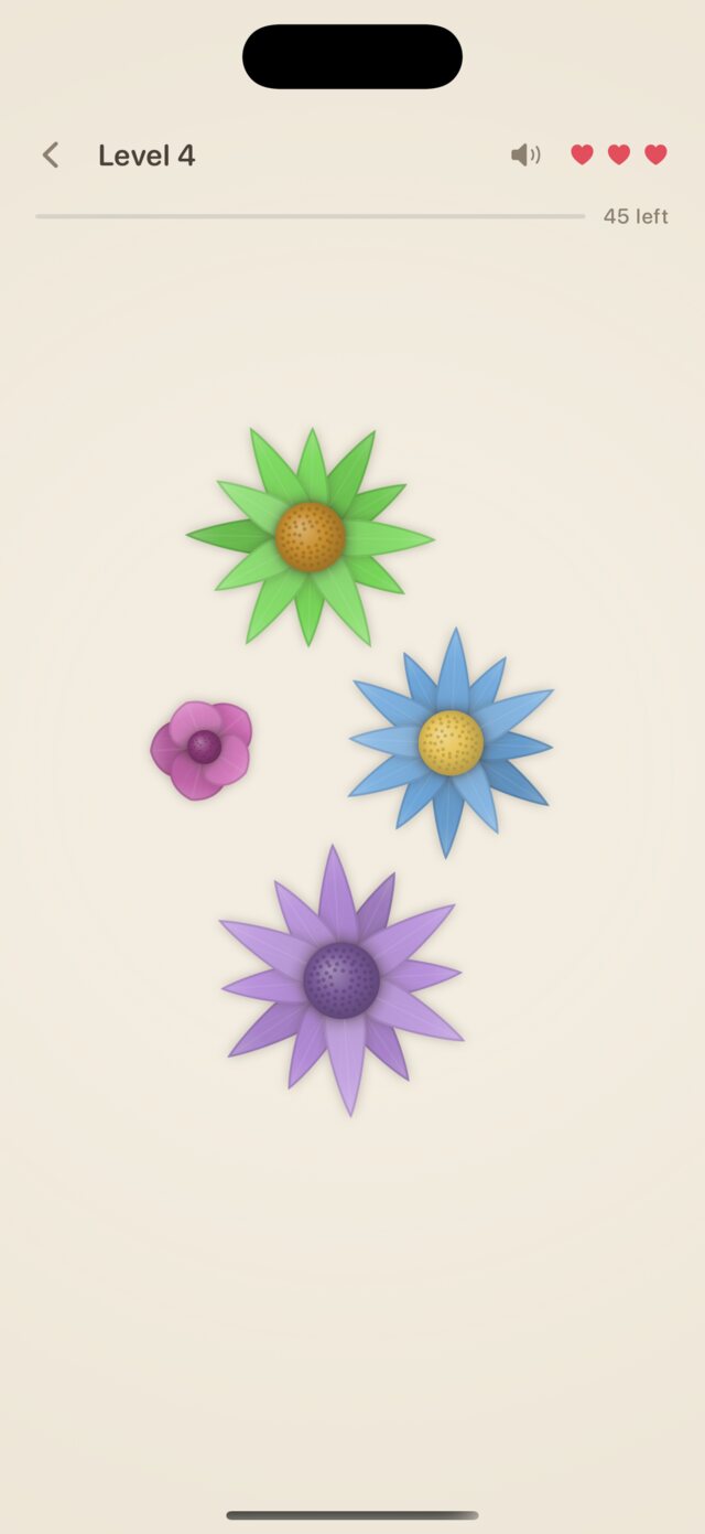 Level 4: four flowers well apart on warm paper, a green daisy, a blue and a violet star-shaped flower, and a small pink blossom.